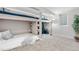 View of bedroom with built-in bunk beds, shelving, and a cozy carpet, illuminated by soft lighting at 7600 Kline Dr, Arvada, CO 80005