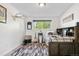 Bedroom with luxury vinyl plank flooring, cowboy-themed decorations, and an accent wall at 7600 Kline Dr, Arvada, CO 80005