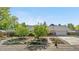 Charming ranch home featuring a beautifully landscaped front yard and a two car garage at 7600 Kline Dr, Arvada, CO 80005