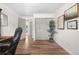 Bright office featuring luxury vinyl plank flooring, closet, and decorative plants at 7600 Kline Dr, Arvada, CO 80005