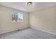 Bright bedroom with plush carpeting, ample natural light, and a serene atmosphere for relaxation and rest at 15650 E Eldorado Dr, Aurora, CO 80013