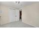 A spacious bedroom with closet, access to the laundry, and neutral walls at 15650 E Eldorado Dr, Aurora, CO 80013