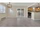 Dining area with sliding glass door that opens to the backyard and open to the kitchen at 15650 E Eldorado Dr, Aurora, CO 80013