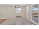 Open dining space featuring a modern chandelier and ample natural light at 15650 E Eldorado Dr, Aurora, CO 80013