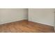 A clean, empty room featuring shiny wood floors, cream walls, and natural light at 15650 E Eldorado Dr, Aurora, CO 80013
