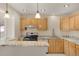 Updated kitchen featuring stainless steel appliances and granite counters at 15650 E Eldorado Dr, Aurora, CO 80013