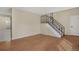 Living room features stairs, wood flooring, and neutral decor at 15650 E Eldorado Dr, Aurora, CO 80013