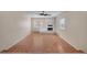 Spacious living room featuring a stone fireplace and wood laminate floors at 15650 E Eldorado Dr, Aurora, CO 80013