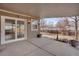 An outdoor covered patio area with access to the backyard, great for relaxing or entertaining guests at 15650 E Eldorado Dr, Aurora, CO 80013