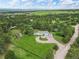 Scenic aerial view of a charming home surrounded by lush greenery and mature trees on a sprawling property at 652 Verdos Dr, Elizabeth, CO 80107