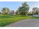 A sprawling backyard features mature trees and a shed in a serene setting at 652 Verdos Dr, Elizabeth, CO 80107