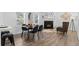 Dining room featuring a fireplace, wood floors and modern decor at 652 Verdos Dr, Elizabeth, CO 80107