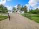 Exterior view of a single story home featuring a gravel driveway and fenced yard at 652 Verdos Dr, Elizabeth, CO 80107