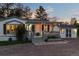 Exterior of a cozy home featuring a charming pergola-covered porch, with a detached building nearby at 652 Verdos Dr, Elizabeth, CO 80107