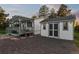 Exterior view of home with covered porch and detached building at 652 Verdos Dr, Elizabeth, CO 80107