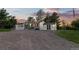 Exterior view of the home featuring a windmill, outbuilding and gravel driveway at 652 Verdos Dr, Elizabeth, CO 80107