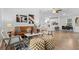 Inviting living room featuring hardwood floors, a leather sofa and neutral colored decor at 652 Verdos Dr, Elizabeth, CO 80107