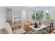 Bright living room with stylish furniture, hardwood floors, and large windows offering serene views at 652 Verdos Dr, Elizabeth, CO 80107