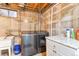 Basement laundry room with washer, dryer, and utility sink at 1381 Mariposa Dr, Denver, CO 80221