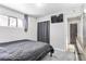 Bedroom with a queen-size bed and large TV at 1381 Mariposa Dr, Denver, CO 80221