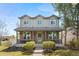 Charming two-story home with a covered porch, brick accents, and well-maintained landscaping at 3422 W 125Th Dr, Broomfield, CO 80020