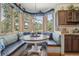 Cozy breakfast nook with built in seating and large windows offering scenic views at 30206 Telluride Ln, Evergreen, CO 80439