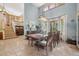 Elegant dining room featuring a large table, high ceilings, and an abundance of natural light at 30206 Telluride Ln, Evergreen, CO 80439