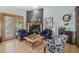 Living room featuring a cozy fireplace, stylish decor, and comfortable seating at 30206 Telluride Ln, Evergreen, CO 80439