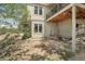 Outdoor patio with slate flooring, swing bench, and view of the home's exterior at 30206 Telluride Ln, Evergreen, CO 80439