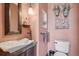 Charming powder room with a vessel sink, stylish fixtures, and decorative accents, unique design at 30206 Telluride Ln, Evergreen, CO 80439