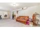 Spacious finished basement with sofa and additional space for storage or activities at 111 S Eaton St, Lakewood, CO 80226