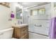 Updated bathroom with new vanity, modern fixtures, and a shower-tub combo at 111 S Eaton St, Lakewood, CO 80226