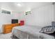 Bedroom with a dresser, window and bed with carpeted floors at 111 S Eaton St, Lakewood, CO 80226