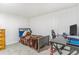 Bedroom with a bed, desk, chair and natural light from window at 111 S Eaton St, Lakewood, CO 80226