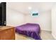 Basement bedroom with carpeted floors, and a wooden dresser at 111 S Eaton St, Lakewood, CO 80226