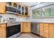Modern kitchen with stainless steel appliances and ample cabinet space at 111 S Eaton St, Lakewood, CO 80226