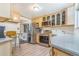 Updated kitchen with stainless steel appliances, modern countertops, and ample storage space at 111 S Eaton St, Lakewood, CO 80226