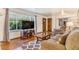 Bright living room featuring wood floors, a large window, and comfortable seating at 111 S Eaton St, Lakewood, CO 80226