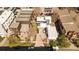Aerial view of a home with a long driveway, and a patio area, in a neighborhood with other homes and trees at 1749 Boulder St, Denver, CO 80211