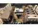 Aerial view of a home's backyard including trees, grass, and parking for many cars, surrounded by other buildings at 1749 Boulder St, Denver, CO 80211