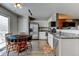 Well-lit kitchen featuring stainless steel appliances, granite counters, and wood-look flooring at 7970 Gorham Ct, Frederick, CO 80530