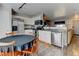 Bright kitchen featuring white cabinets, stainless steel appliances, and granite countertops at 7970 Gorham Ct, Frederick, CO 80530