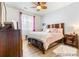 Comfortable bedroom with a queen-sized bed, soft lighting, and neutral decor at 833 E 98 Ave # 204, Thornton, CO 80229