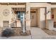 Close up of the entrance to a townhome featuring a porch and drought tolerant landscaping at 833 E 98 Ave # 204, Thornton, CO 80229