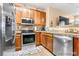 Well-equipped kitchen featuring stainless steel appliances, granite countertops and wooden cabinetry at 833 E 98 Ave # 204, Thornton, CO 80229