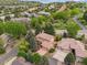 Stunning aerial view of a home nestled amongst lush greenery, showcasing its prime location and natural surroundings at 10506 Brown Fox Trl, Littleton, CO 80125