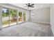 Bright, spacious bedroom featuring a sliding glass door to a private balcony with natural light and scenic views at 10506 Brown Fox Trl, Littleton, CO 80125
