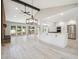 Bright, open kitchen with an island, modern appliances, and a seamless flow to the outdoor deck via sliding glass doors at 10506 Brown Fox Trl, Littleton, CO 80125