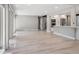 Bright and open living area with open concept layout, modern kitchen, large windows, and hardwood floors at 10506 Brown Fox Trl, Littleton, CO 80125