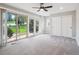 Spacious main bedroom featuring sliding doors, a ceiling fan, and a closet at 10506 Brown Fox Trl, Littleton, CO 80125